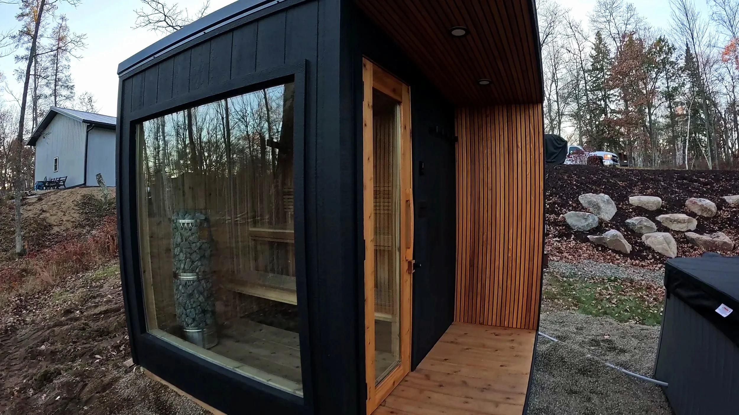 Custom-built indoor sauna designed and installed in Crosslake, MN with natural wood and premium IKI Pillar sauna heater