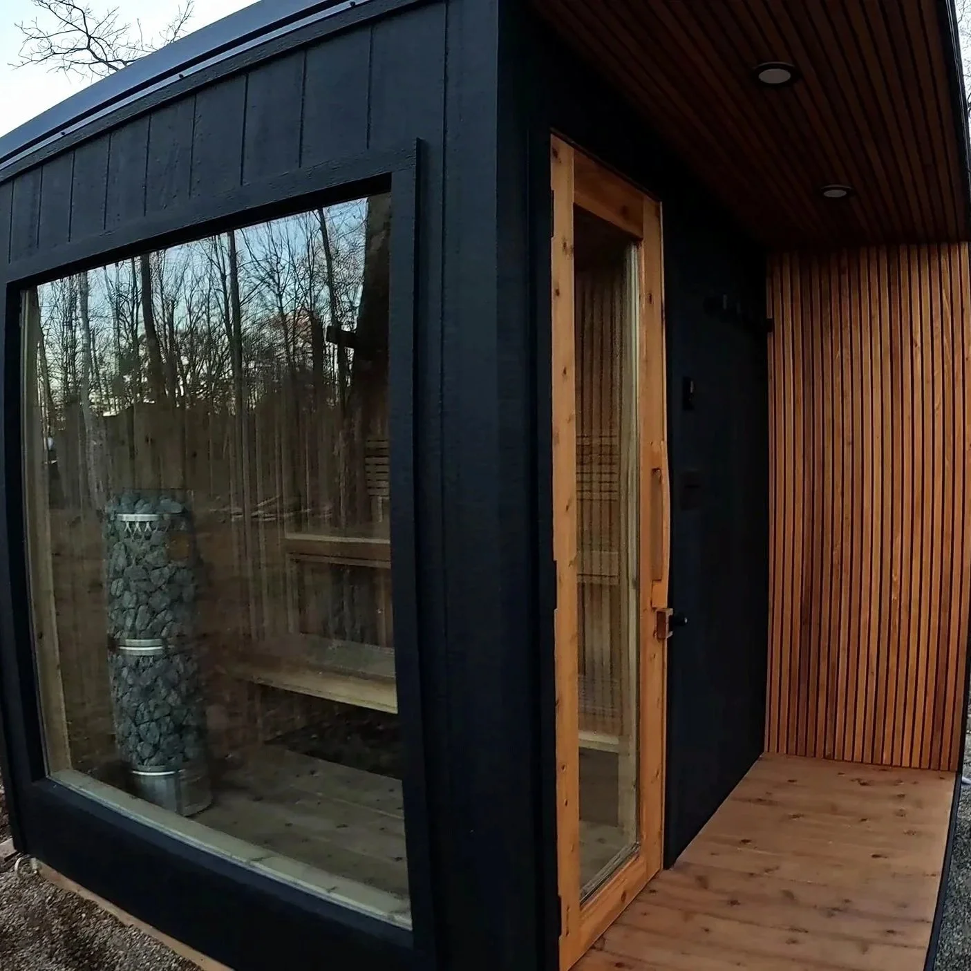 Custom-built indoor sauna designed and installed in Crosslake, MN with natural wood and premium IKI Pillar sauna heater
