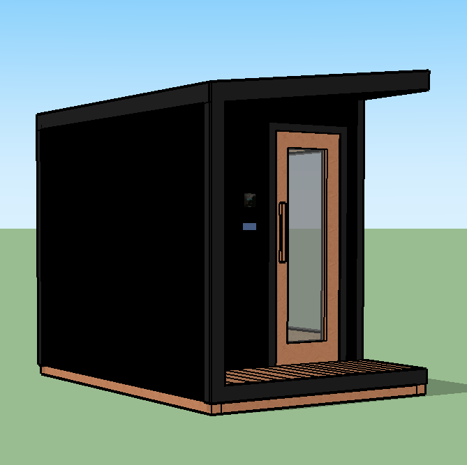Small modern black tiny house with a glass door and wood trim, situated on a grassy area with a clear blue sky.
