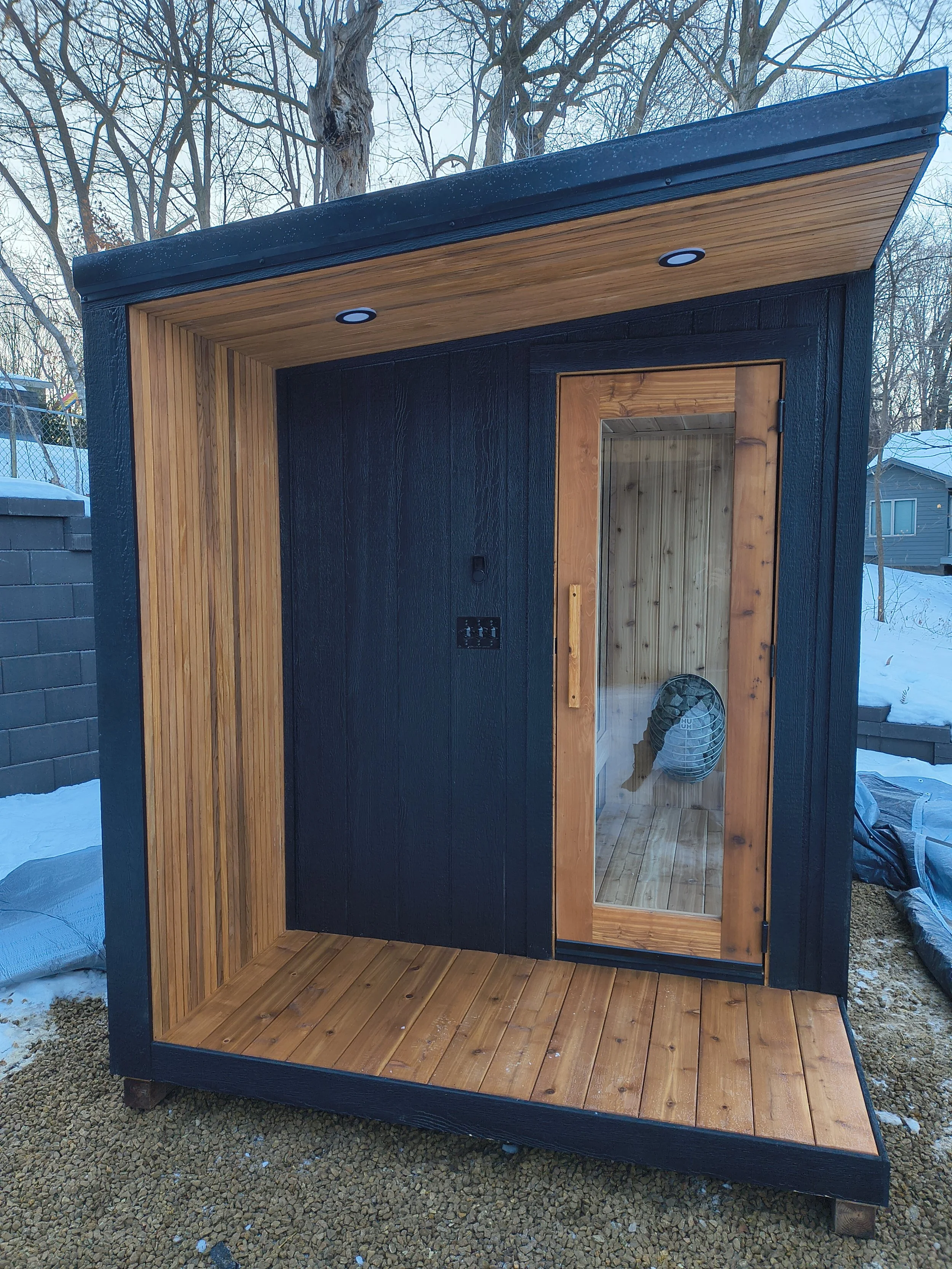 Modern outdoor sauna with clean wood lines and weather-resistant exterior design