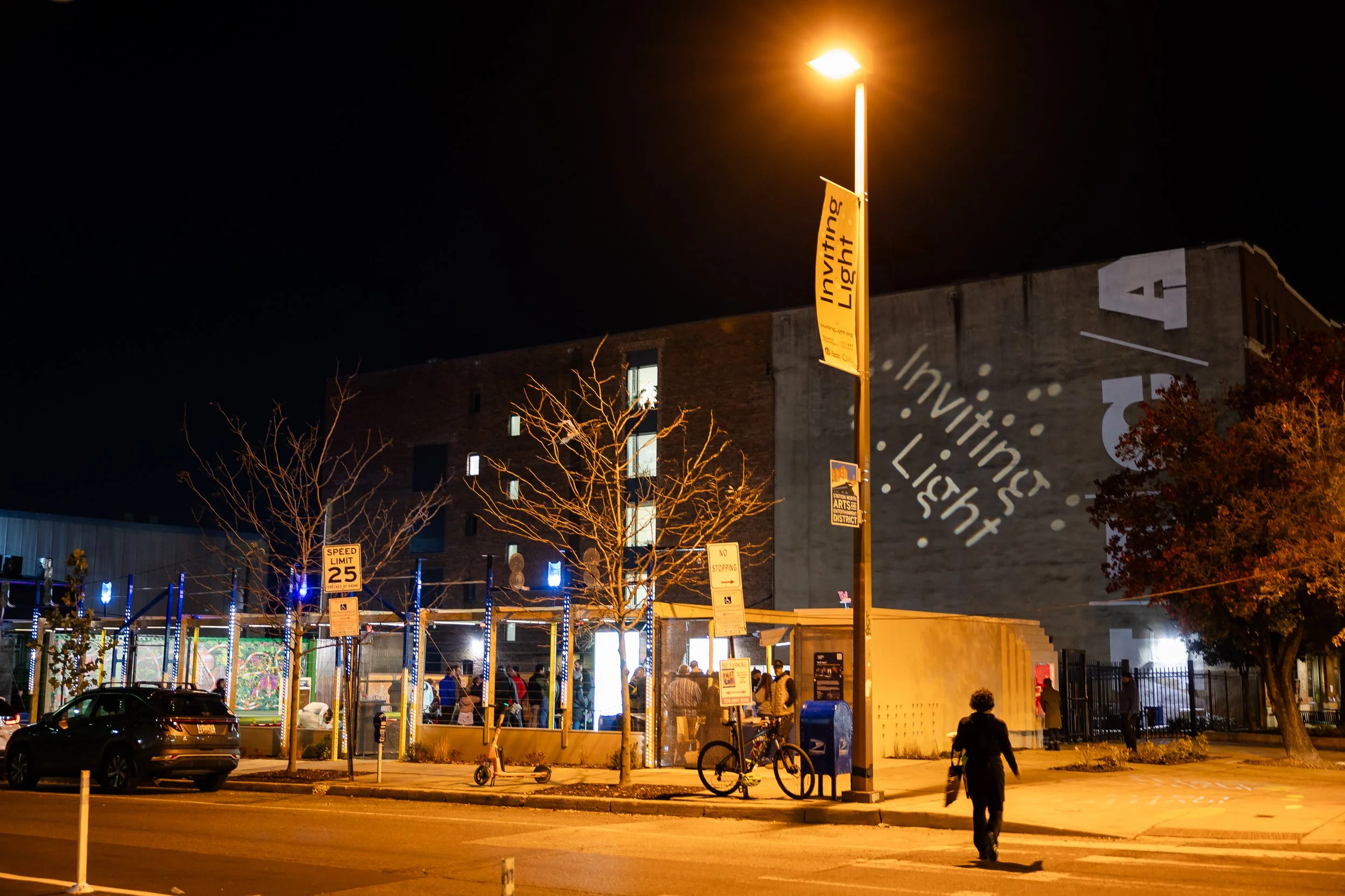 Nighttime street view of the Ynot Lot exterior.
