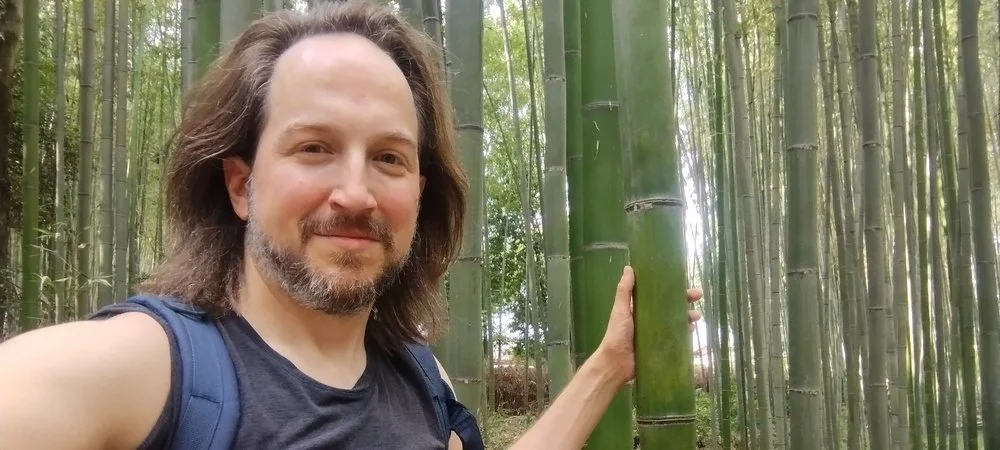 Author Alex Rogers in a grove of bamboo.