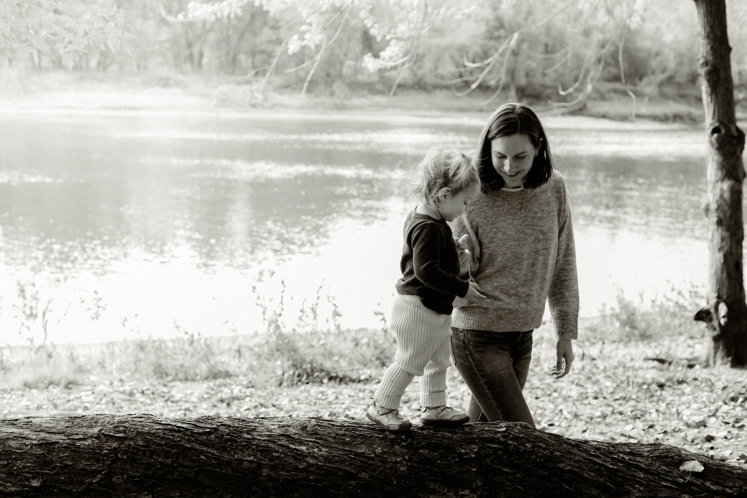 Mom and daughter walking together during a family photography session in Minneapolis.
