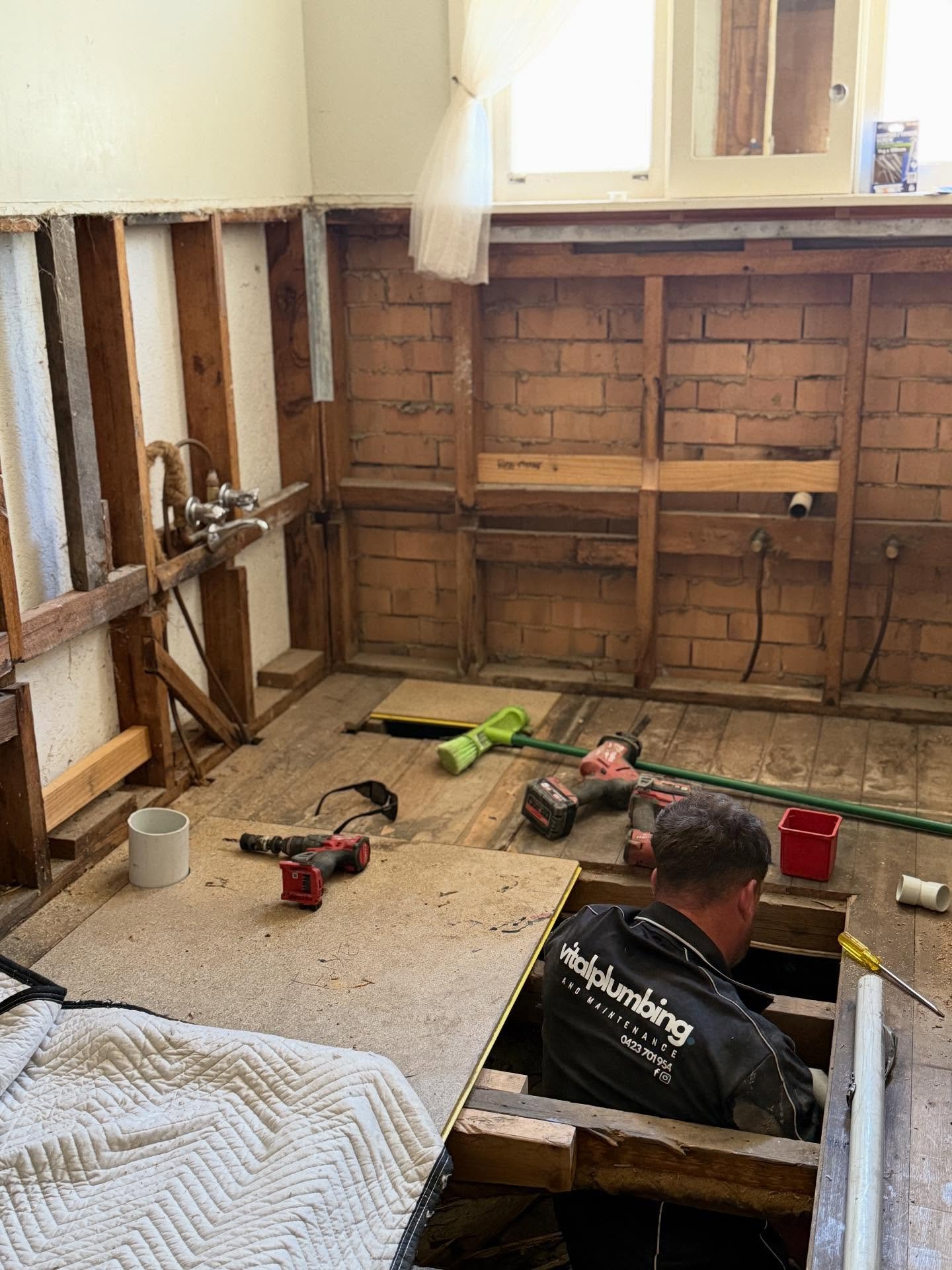 Suspended drains beneath the house ready for a bathroom renovation.