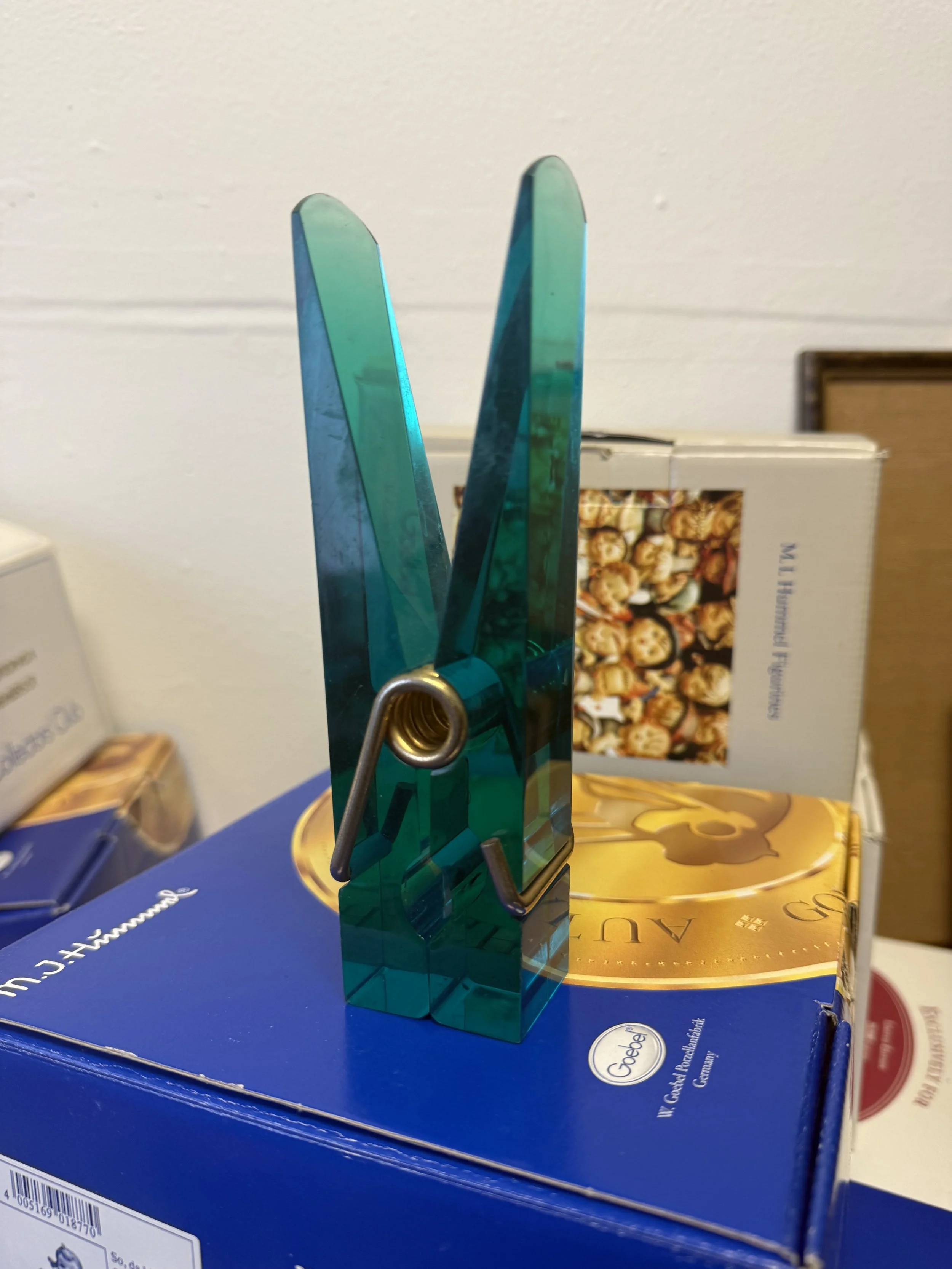 photo of a vintage teal lucite oversized clothespin