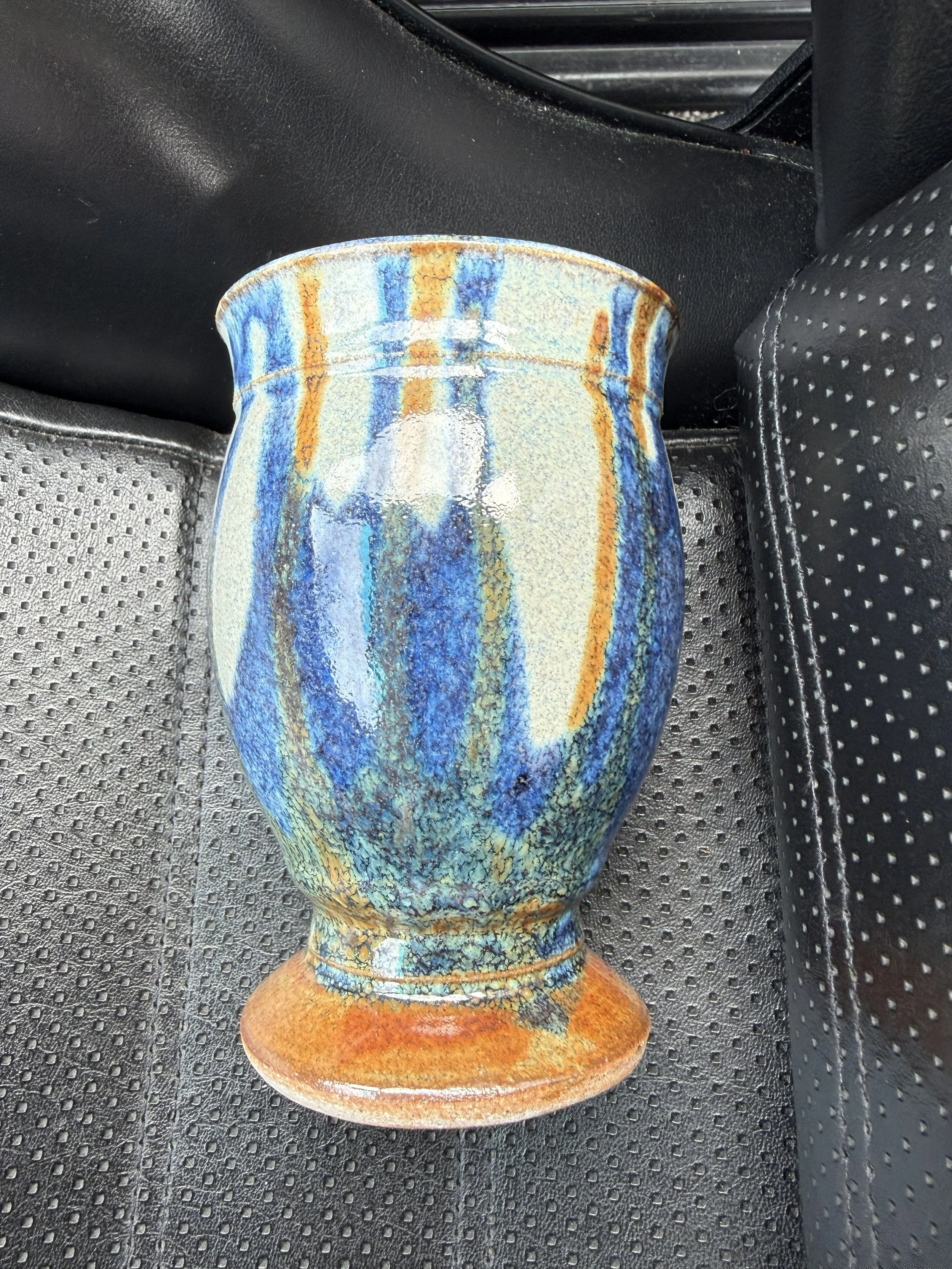  Just a really lovely studio pottery piece. The picture’s a little overexposed so it’s not showing how bold and pretty the drip glaze colors are. It’s a great weight and would look sooooo pretty with some wildflowers anywhere in your home.  