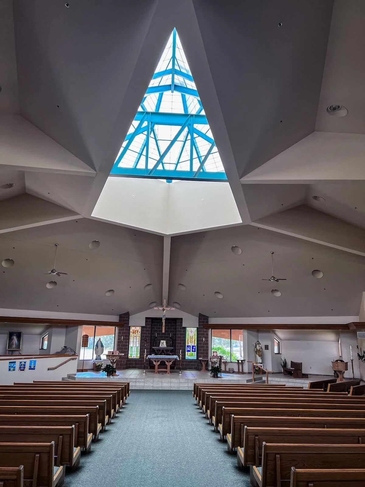 Main sanctuary with pews underneath the feature diamond skylight.jpg