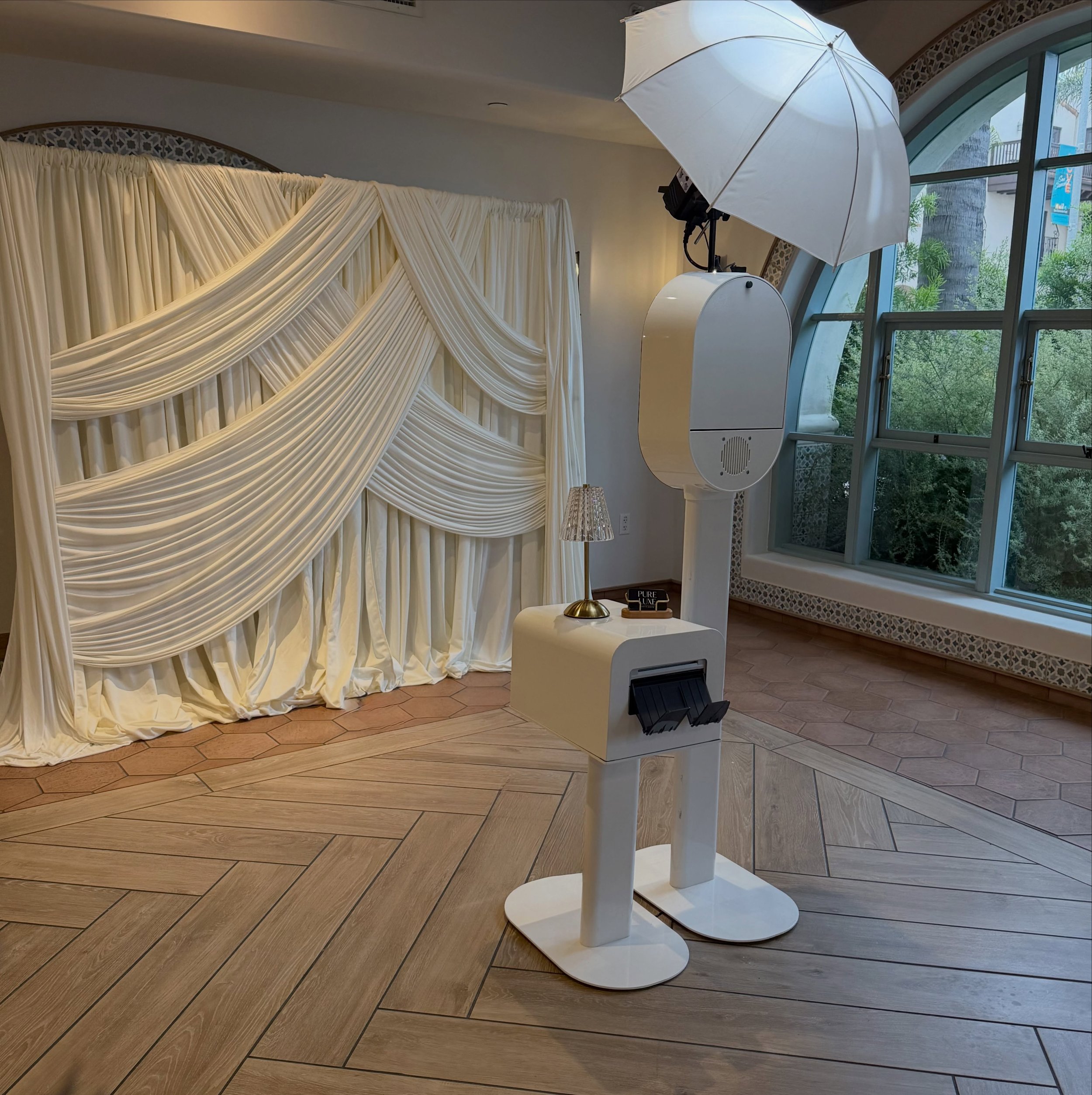 The details set the tone.

Layered draping, soft lighting, and an experience designed to complement the room.