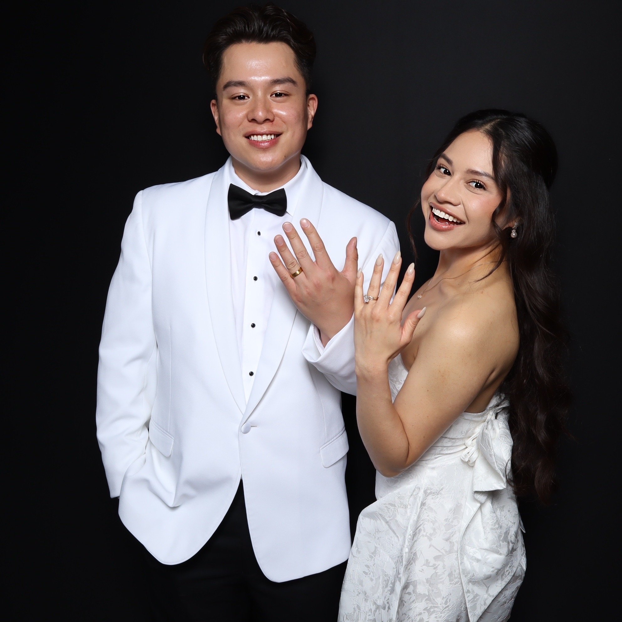 Bride and groom enjoying a luxury Orange County photo booth experience