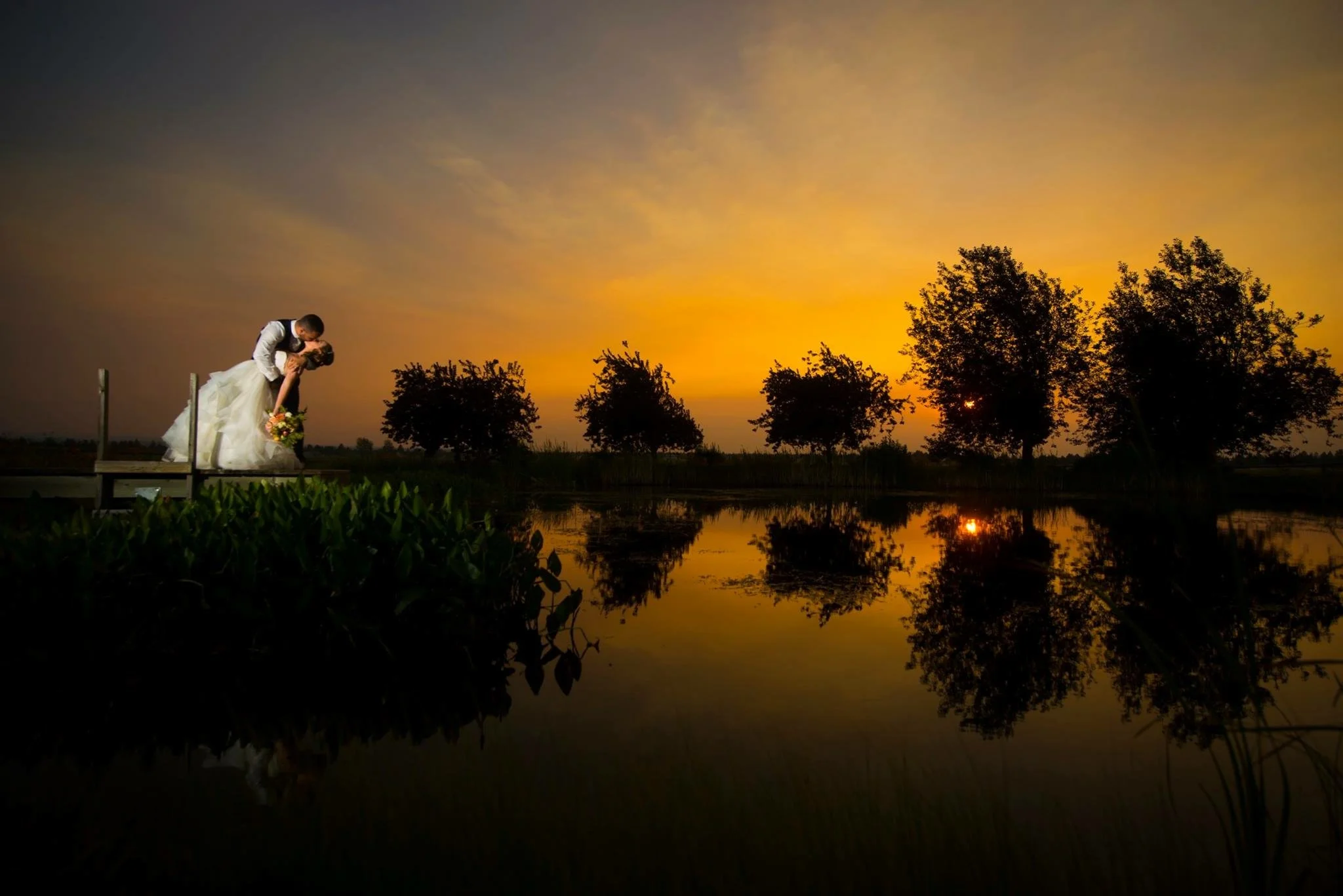 bride and groom at sunset - byron roe photography
