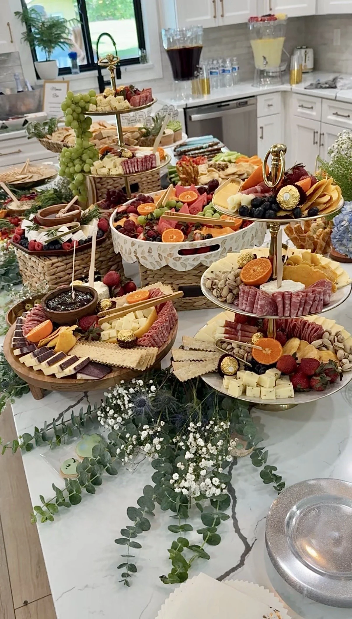 Elaborate grazing table spread with charcuterie, artisan cheeses, dips, fresh produce, and accoutrements in Jacksonville, Florida.
