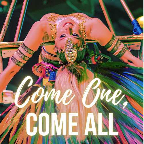 A colorful performer lying backward on a swing, wearing a vibrant costume with a bejeweled headpiece and smiling, with the text 'Come One, Come All' overlaid.