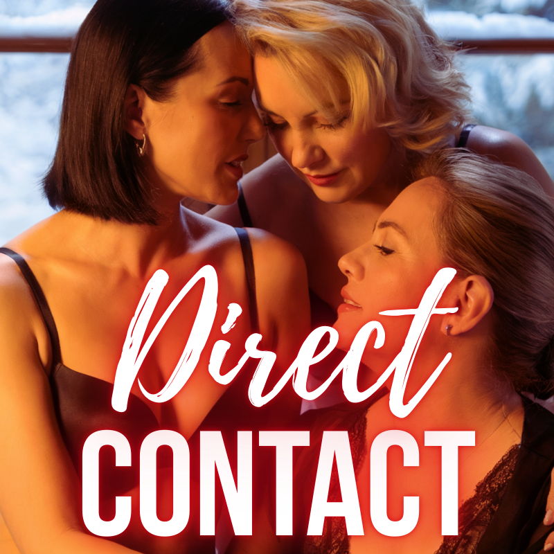 Three women with close hair and makeup are gazing at each other intimately, with two of them touching foreheads. They are indoors with a blurred background and part of a window visible.