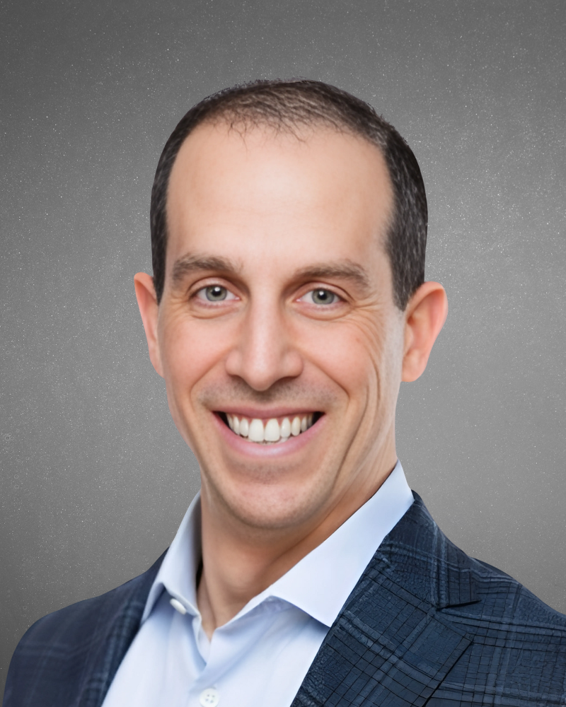 Professional headshot of a smiling man in a suit against a starry night sky background.