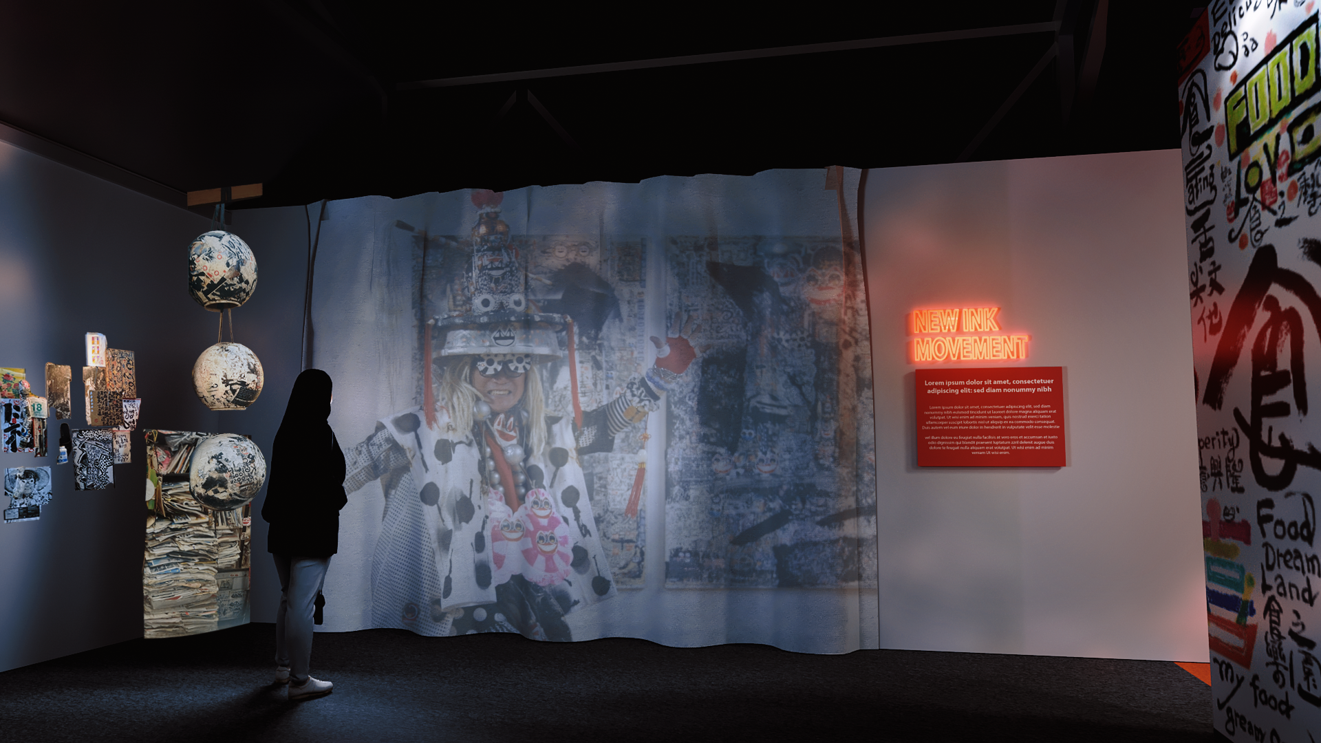 A person viewing an art exhibit with a large projected image of a person dressed in colorful, eclectic clothing and accessories; there are hanging paper lanterns and a wall with text and graffiti-style art.