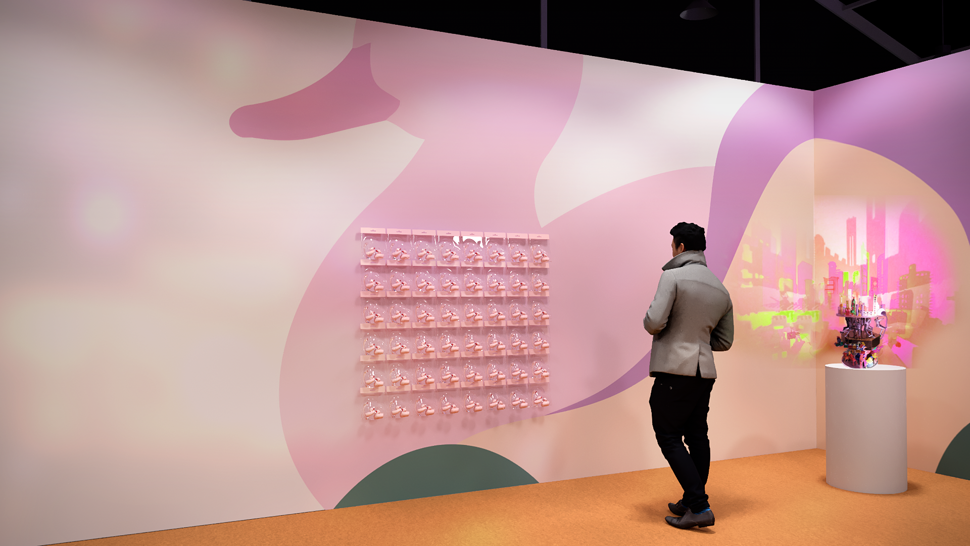 A person in a beige coat and black pants stands in an art gallery, looking at a wall display of pink and white figurines and an abstract colorful cityscape artwork on the wall.