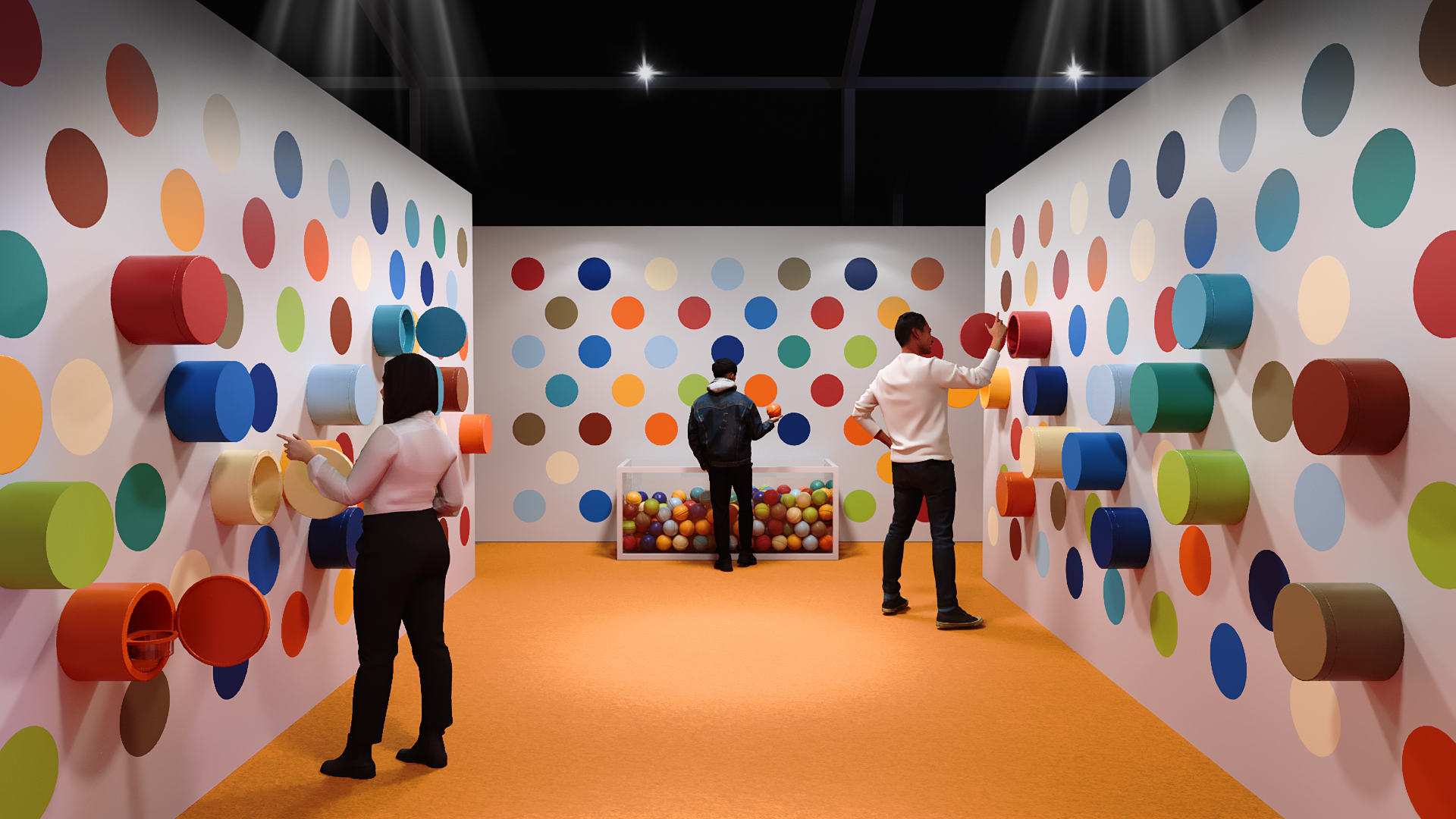 An interactive art installation with colorful cylindrical protrusions on white walls, and a box of multicolored balls in the center. Three people are engaging with the pieces on the walls in a room with an orange carpet.