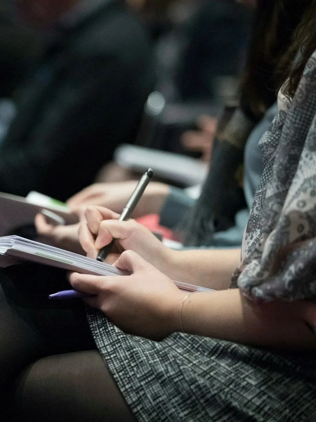 Legal Professional taking notes at a training