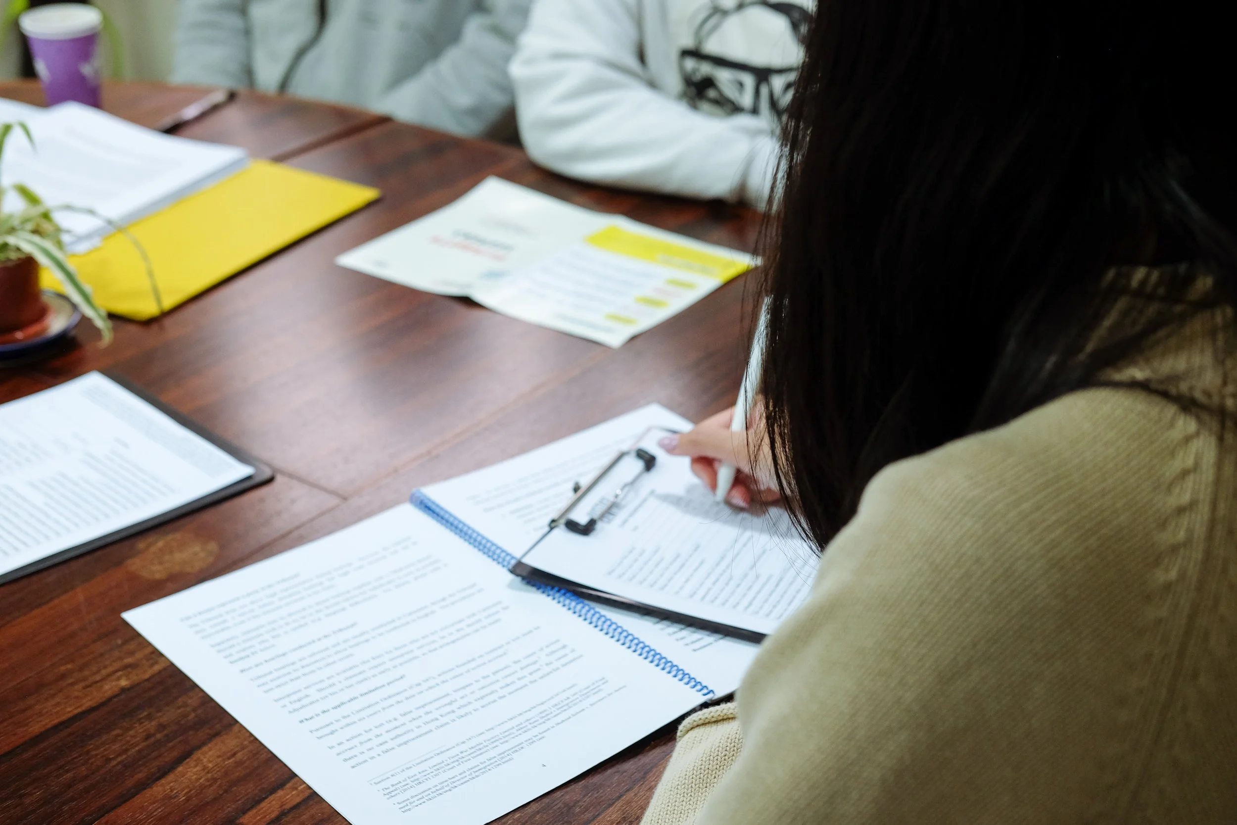 ASK legal team filling our forms with clients