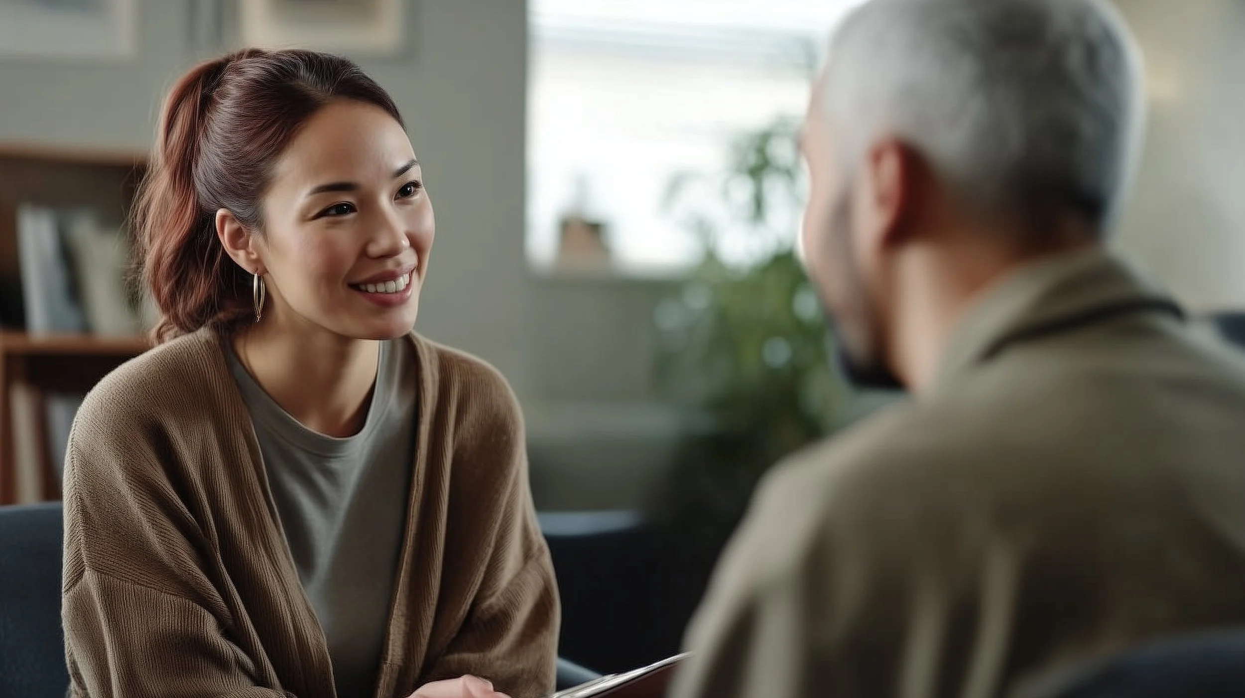 Mental health professional talking with client