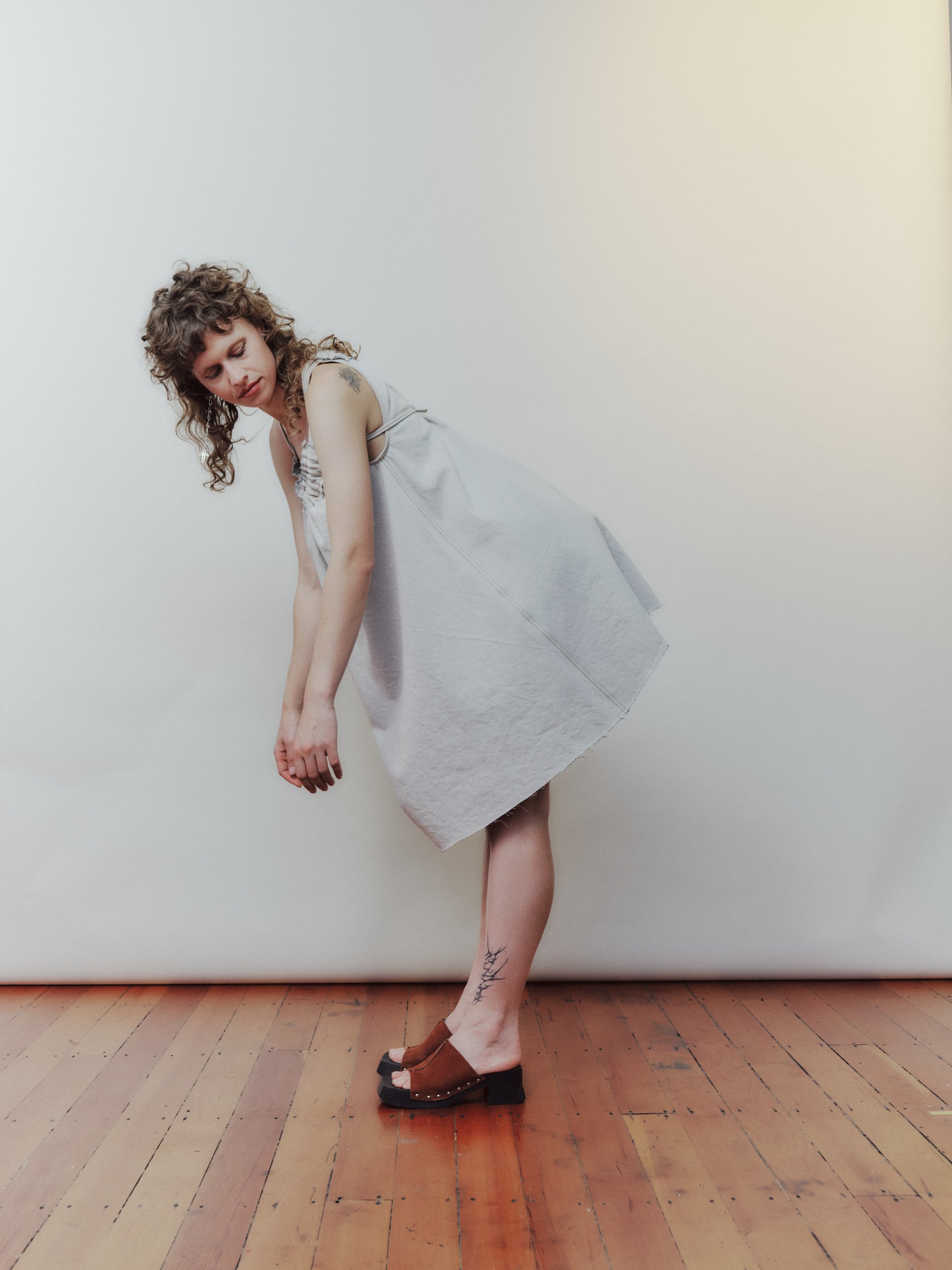 Daf Nimkovsky Woman in White Nippers Mini Dress in Denim Side