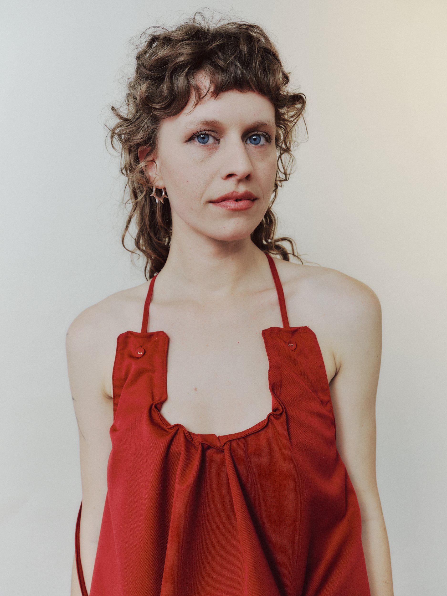 Daf Nimkovsky Woman in Red Lee Dress in Wool Close Up