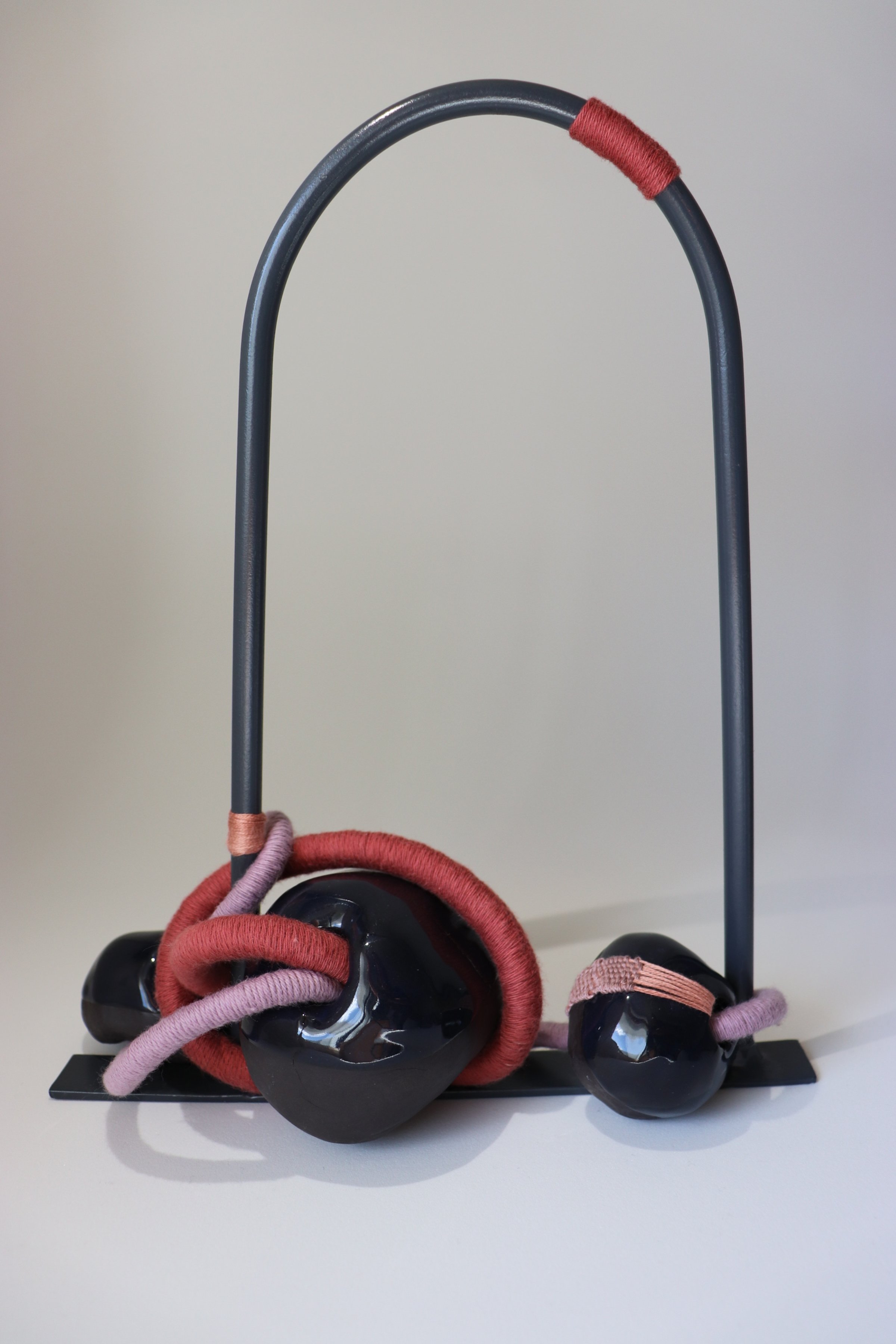 Constant, 2025. Steel, paint, glazed ceramic forms, rope, cotton thread.