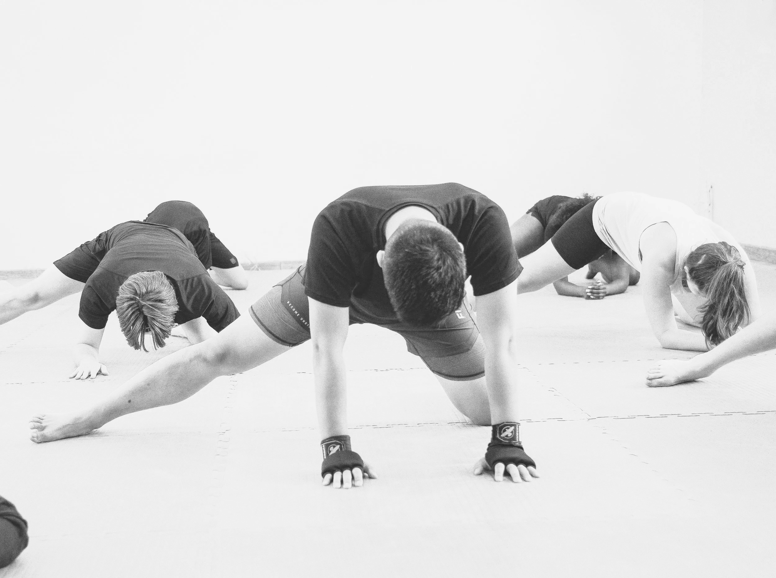 Mixed self-defence group stretching after training