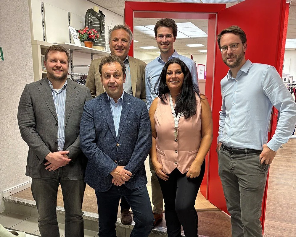 Zwei Neusser aus Berlin: Caritas-Türen offen halten Kaufhaus als Brücke zur sozialen Integration