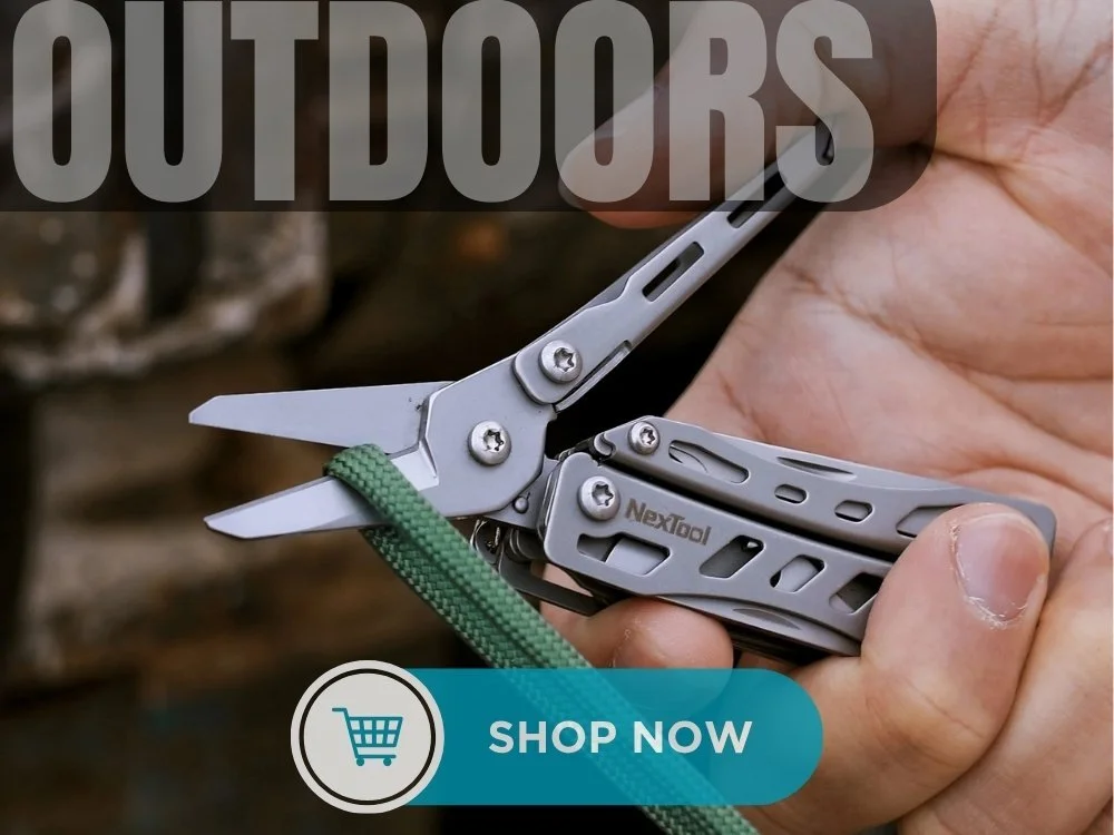Close-up of a person's hand holding a multi-tool with silver blades and gray handle, attached to a green rope, against outdoor background. Text on image says "OUTDOORS" and 
