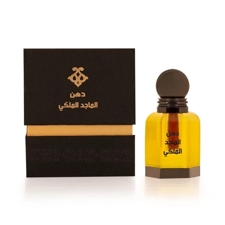 Al Majed Oud Dehn Oud Al Majed Al Malaki 3ml next to box, premium oud oil UK