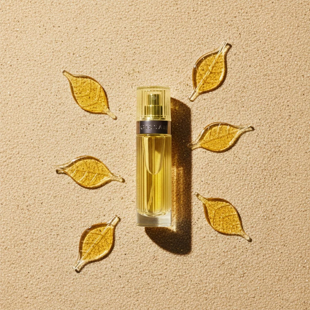 Gissah No.4 Pure roll-on perfume displayed on a sand background with leaf petals, showcasing modern floral Arabian luxury fragrance