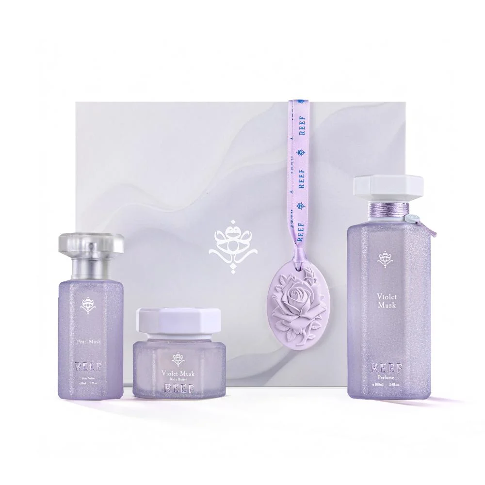 Reef Violet Musk collection set with perfume, hair mist and body butter in front of box, luxury Arabian gift set UK
