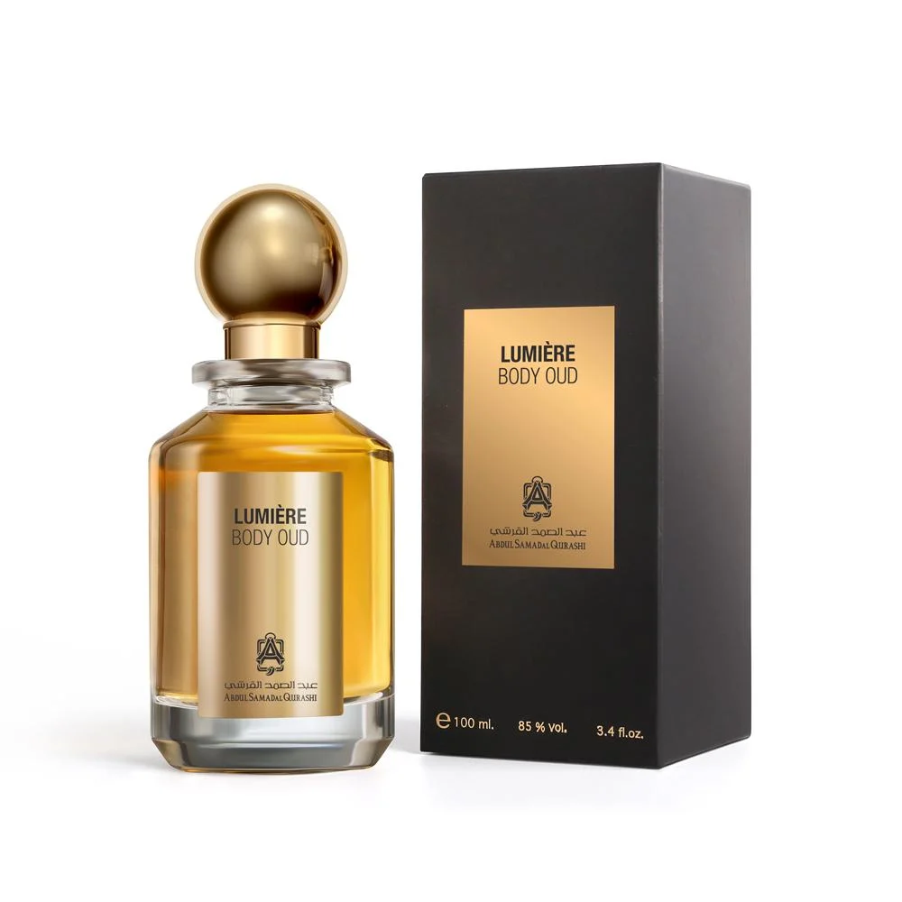 Abdul Samad Al Qurashi Body Oud Lumiere perfume displayed beside its luxury box – ASAQ fragrance UK