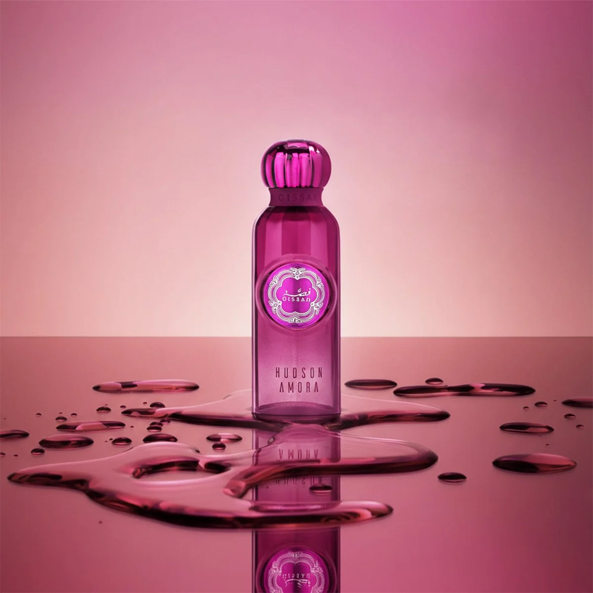 Hudson Amora EDP bottle on purple backdrop with water splash, artistic luxury presentation for Al Rashid Galleria