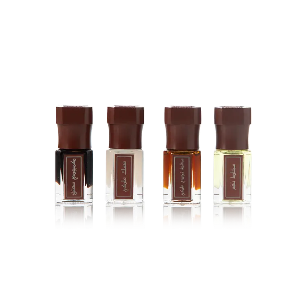 Arabian Oud luxury oil set with four perfume oils on white background, attar collection UK