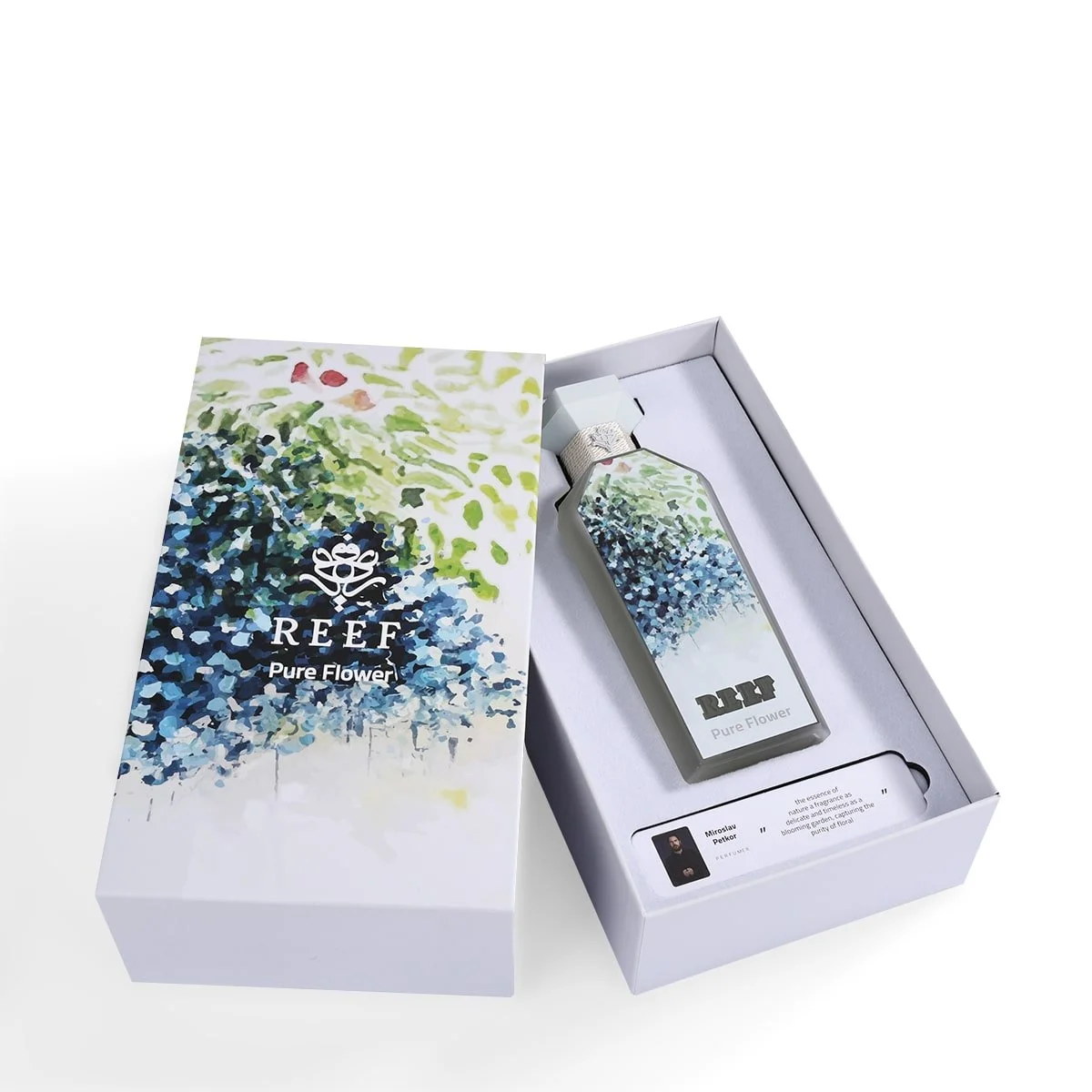 Pure Flower by Reef Perfumes shown inside its box with front packaging visible, unisex floral fragrance from Al Rashid Galleria UK