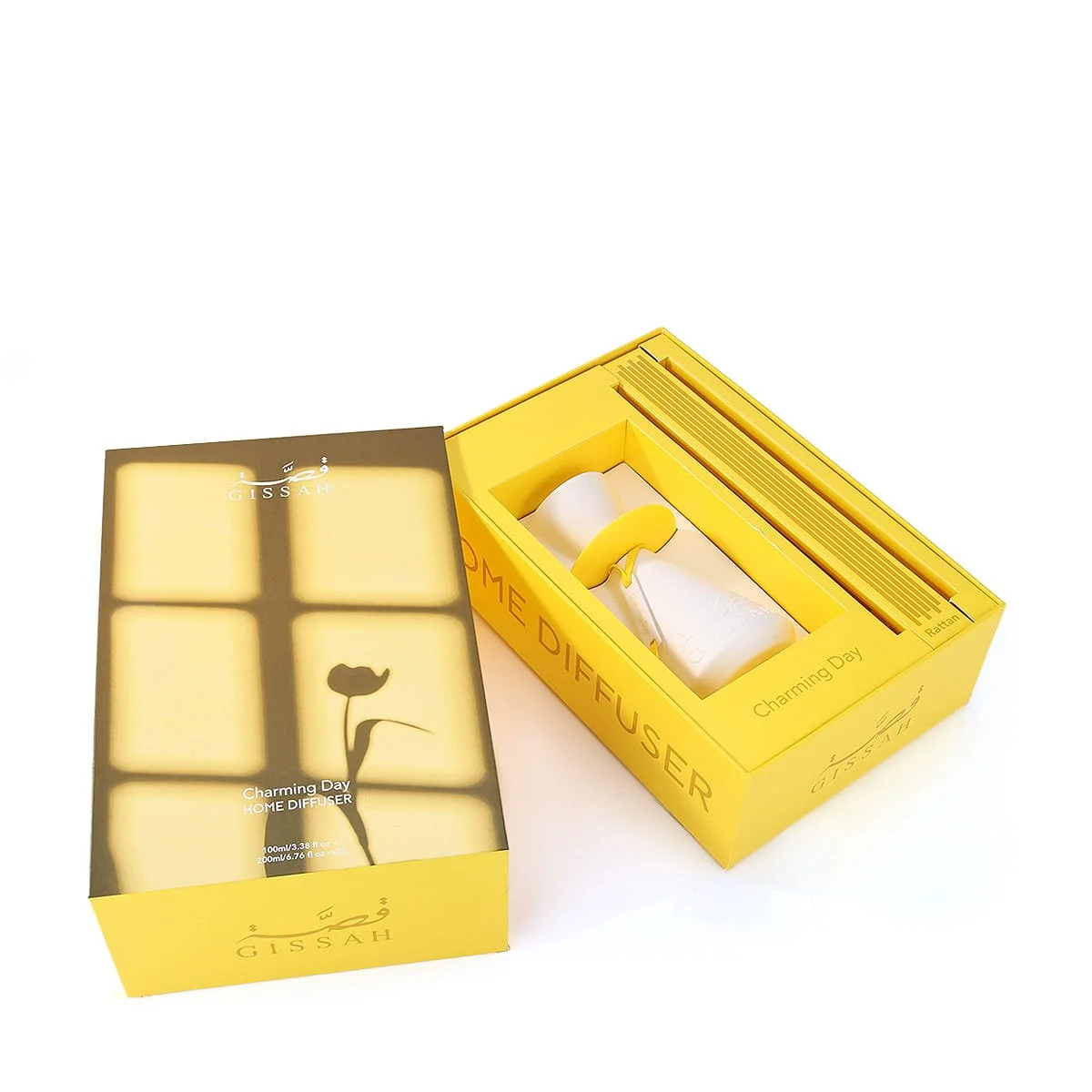 Top view of Gissah Charming Day diffuser set inside open box with rattan sticks, premium UK home fragrance
