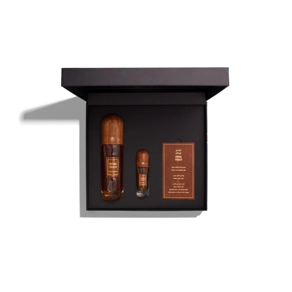 Vintage Tobacco by Ibraheem Al Qurashi displayed inside its open luxury box with 100ml and 10ml bottles and Arabic card visible.
