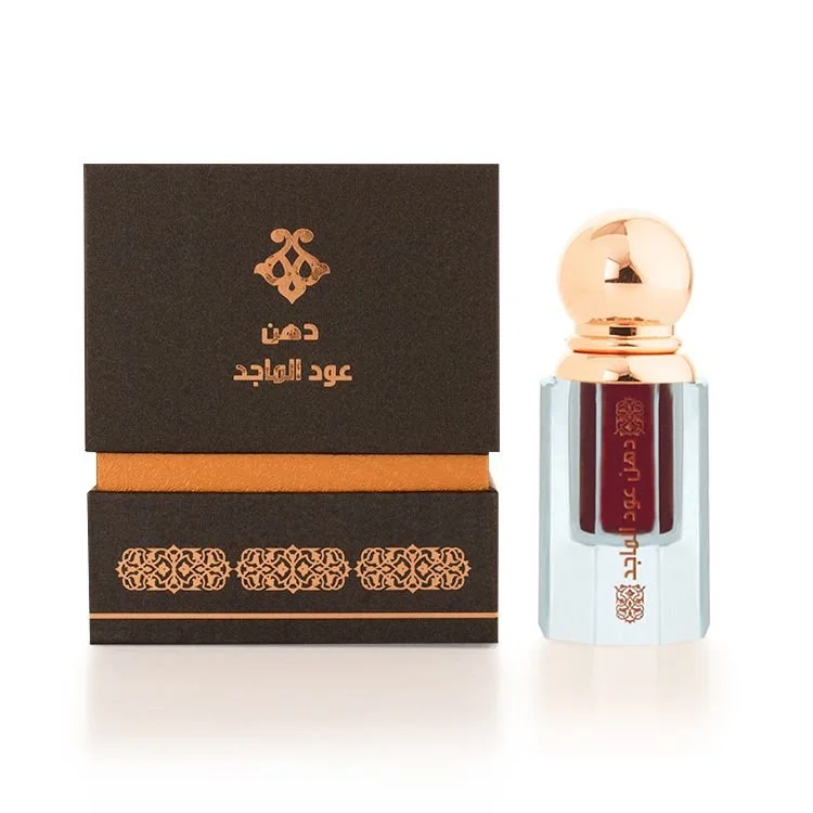 Al Majed Oud Dehn Oud Al Majed 3ml next to box, premium oud oil UK
