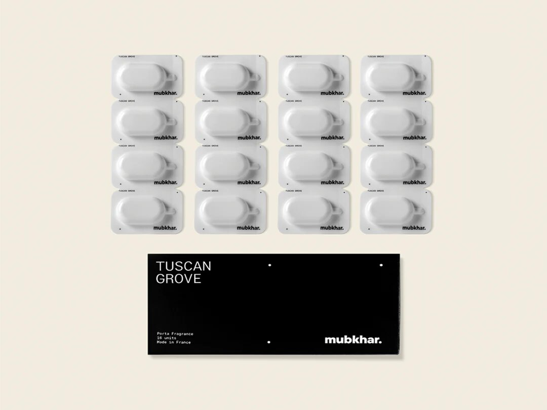 Mubkhar Porta Fragrance Tuscan Grove capsules next to box, luxury portable fragrance UK