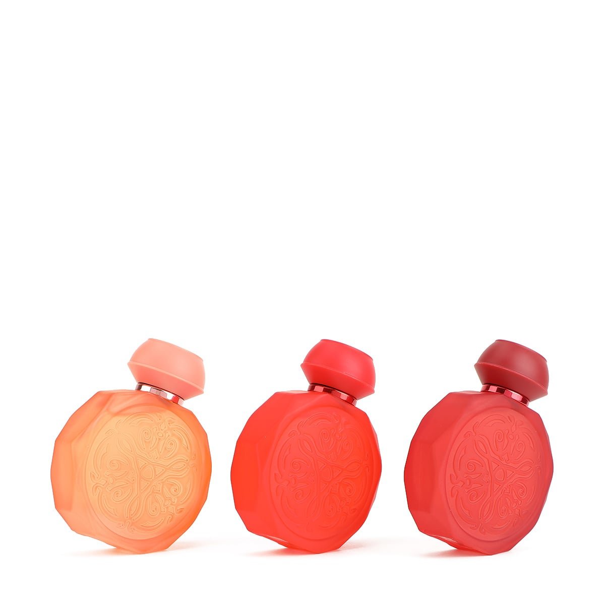 Slanted view of Gissah Shades Of Love perfume set showcasing elegant bottle design