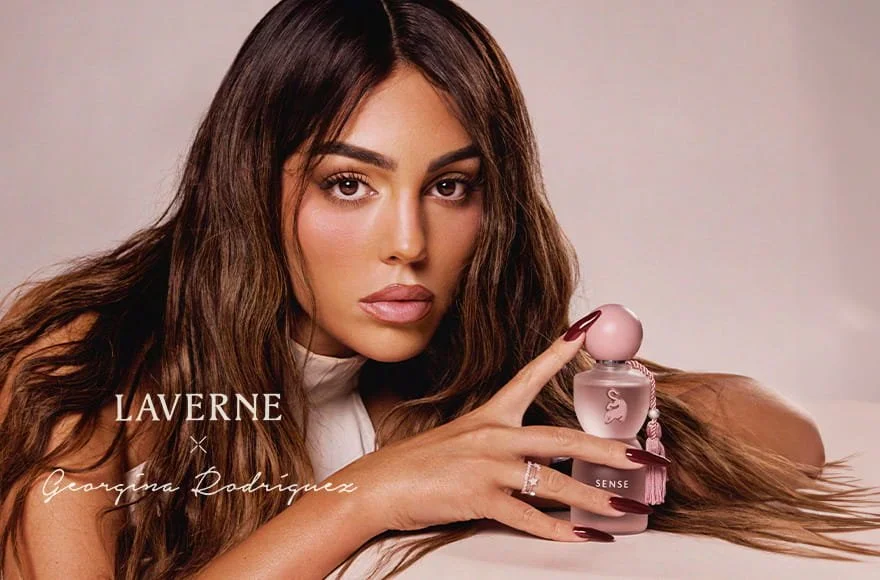 Georgina Rodríguez holding Sense by Laverne perfume in official luxury campaign imagery