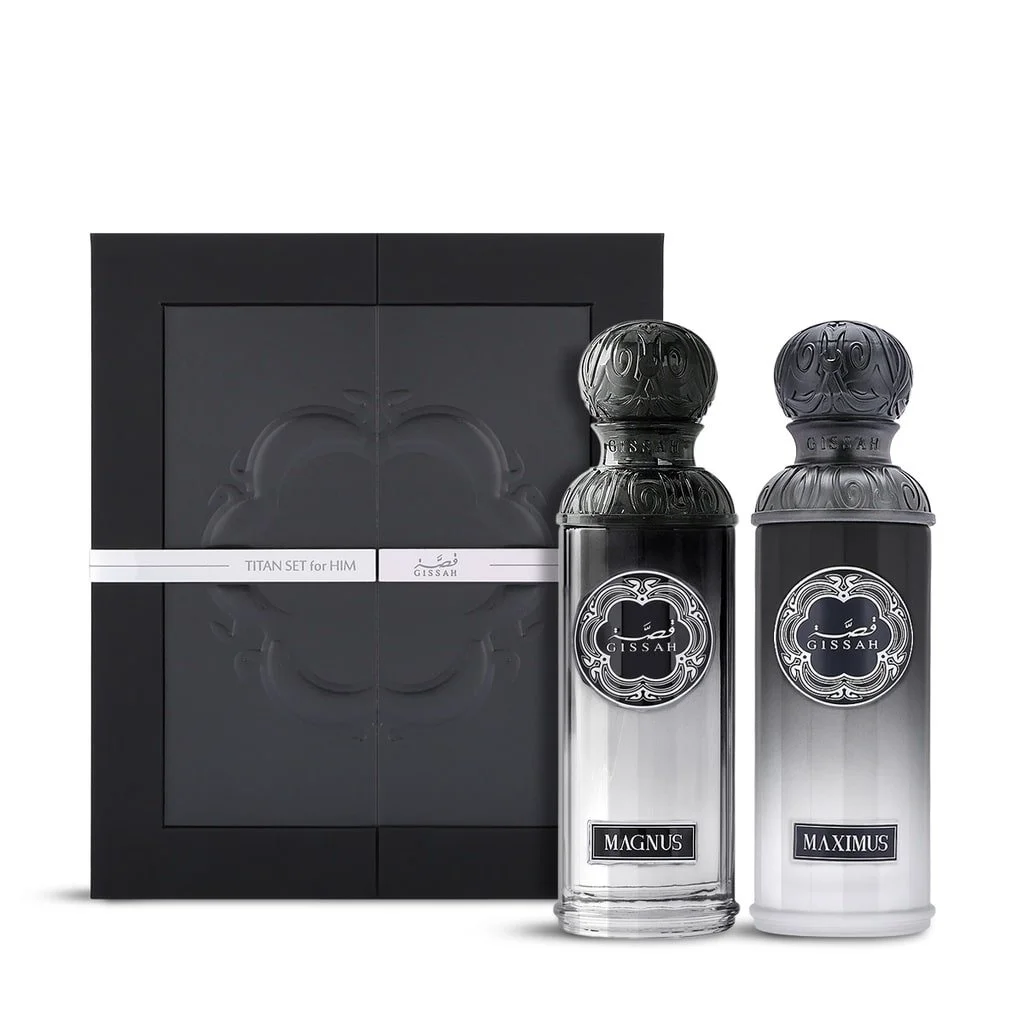 Titan Him perfumes Maximus and Magnus displayed beside their elegant black presentation box.