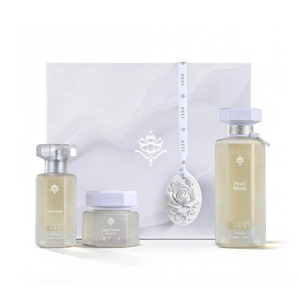 Reef Pearl Collection set with perfume, hair mist and body butter in front of box, luxury Arabian gift set UK
