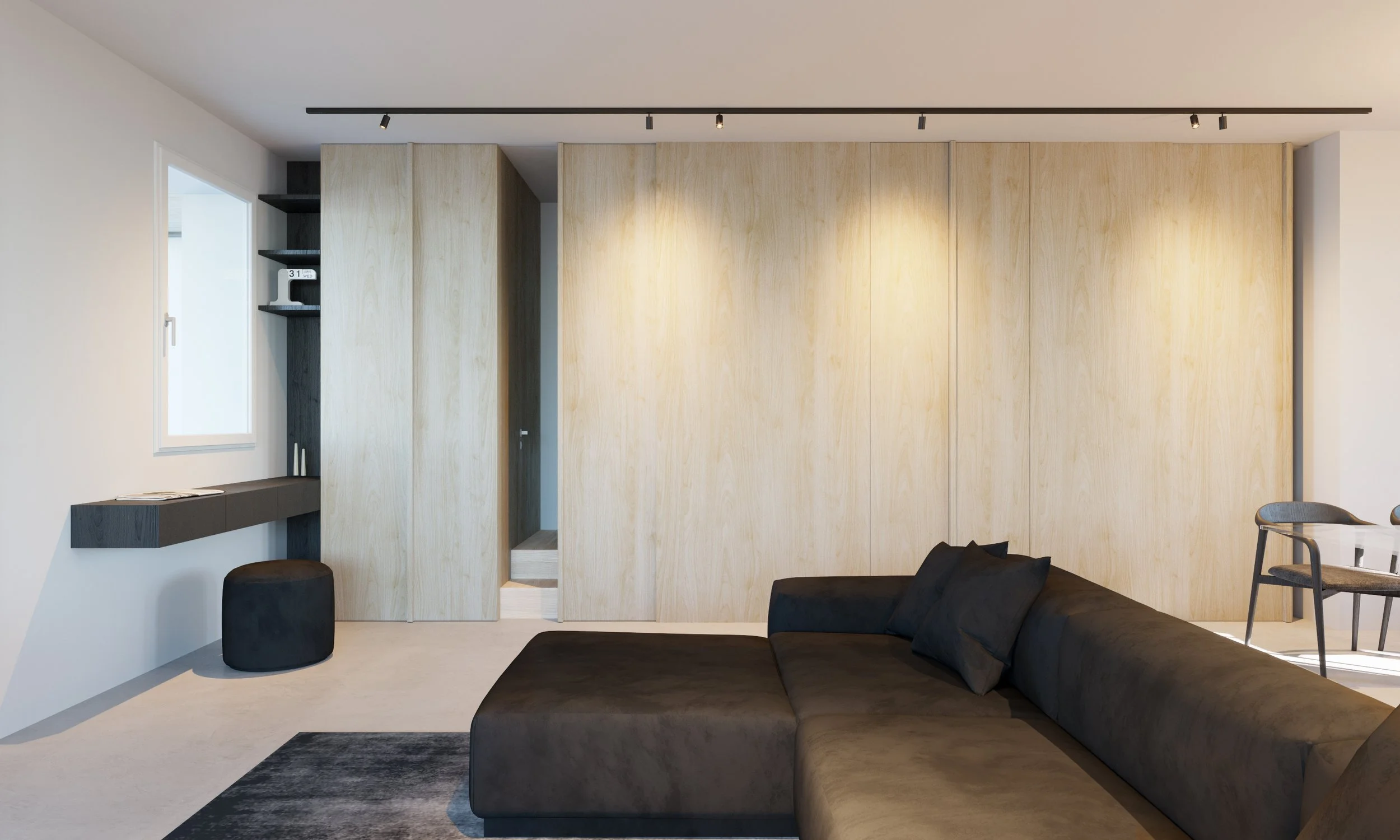 Soggiorno moderno con divano nero, parete di pannelli di legno chiaro, finestra, mensole nere e pouf in pelle nera
