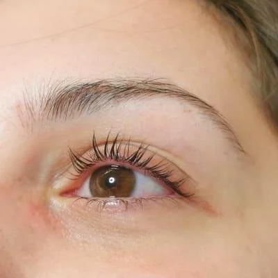 Close-up of a woman's eye with long eyelashes