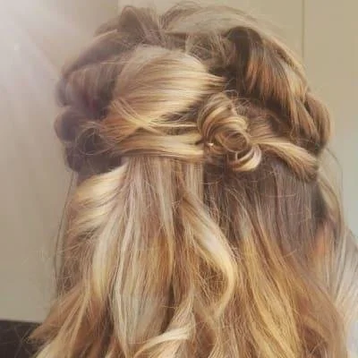 Intricate braided hairstyle with curls