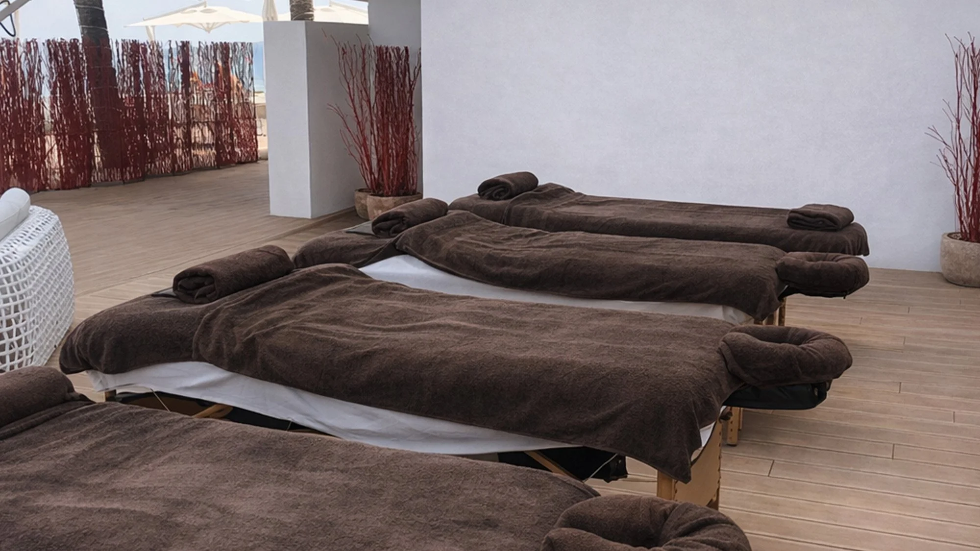 Professional mobile massage treatment beside a private villa pool in Ibiza