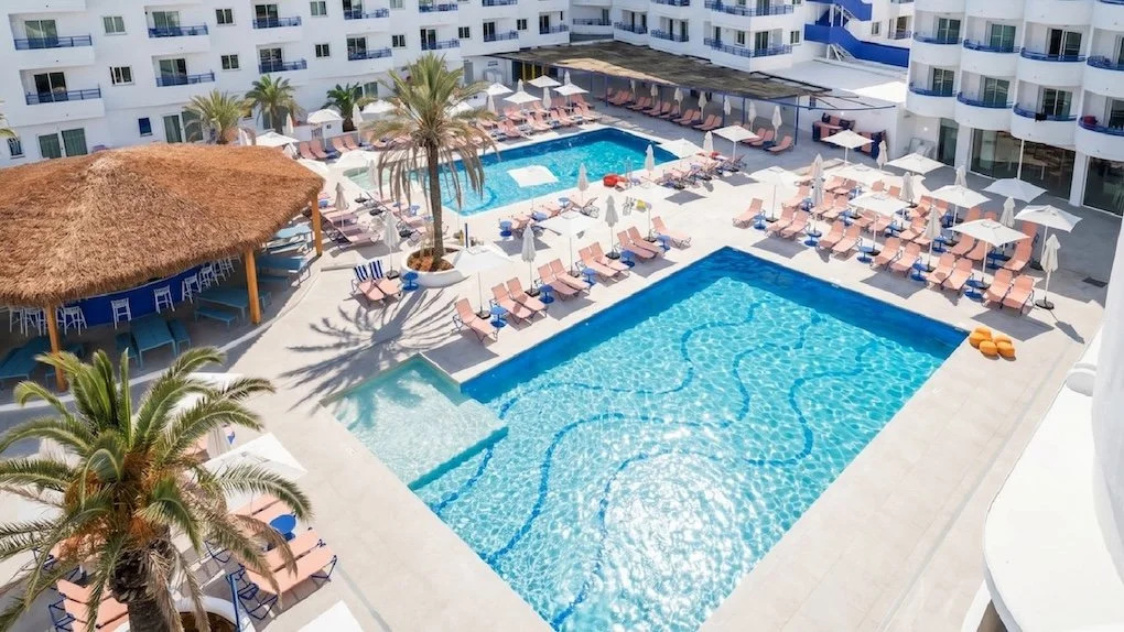 Massage Beach therapist providing a poolside massage at Coral Star Hotel Ibiza in San Antonio Bay